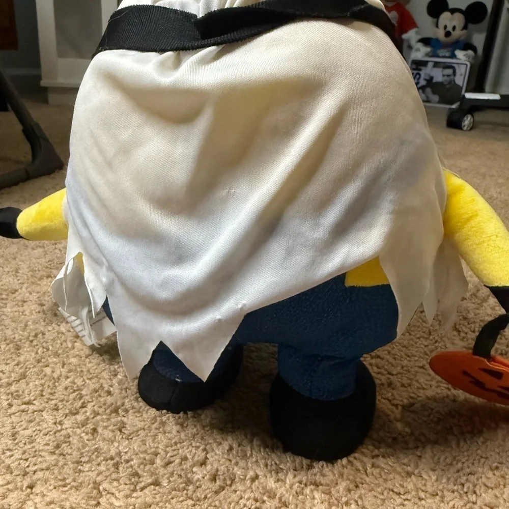 Minion plush toy dressed as a ghost for Halloween